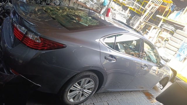 Dark grey Lexus ES sedan rear side — tail light, doors, quarter panel and alloy wheel, Sharjah market