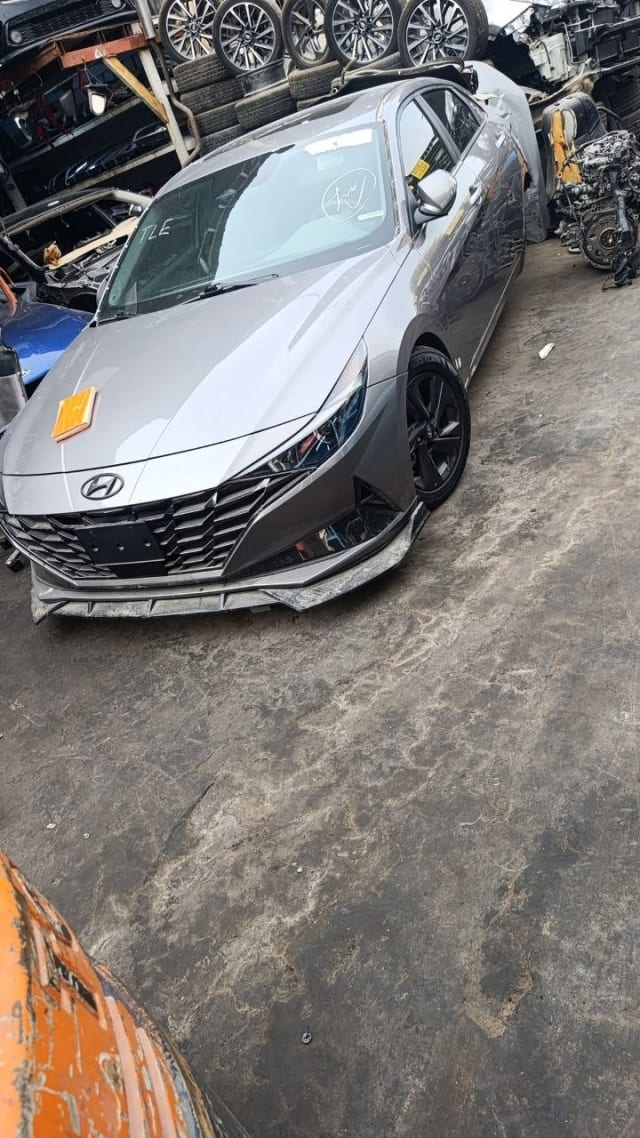 Silver Hyundai Elantra sedan for parts — front bumper, grille, headlights and hood, Sharjah market