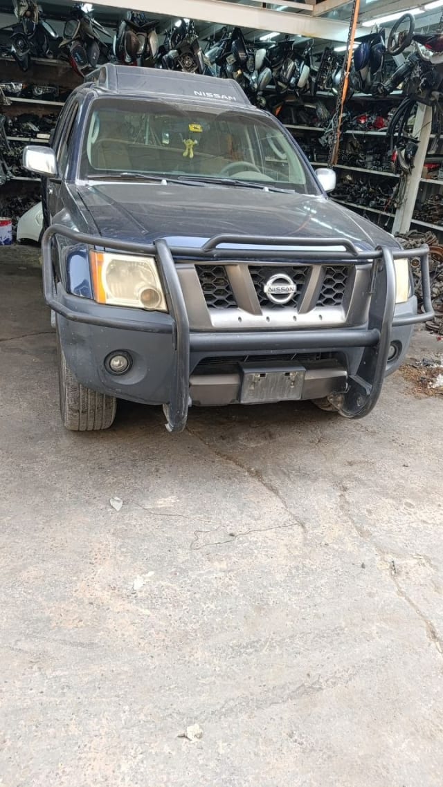Dark blue Nissan Xterra SUV front — bumper, grille, headlights, hood and brush guard, Sharjah market