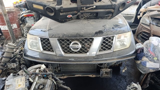 Dark grey Nissan Navara pickup halfcut — grille, headlights, hood and radiator support, Sharjah market