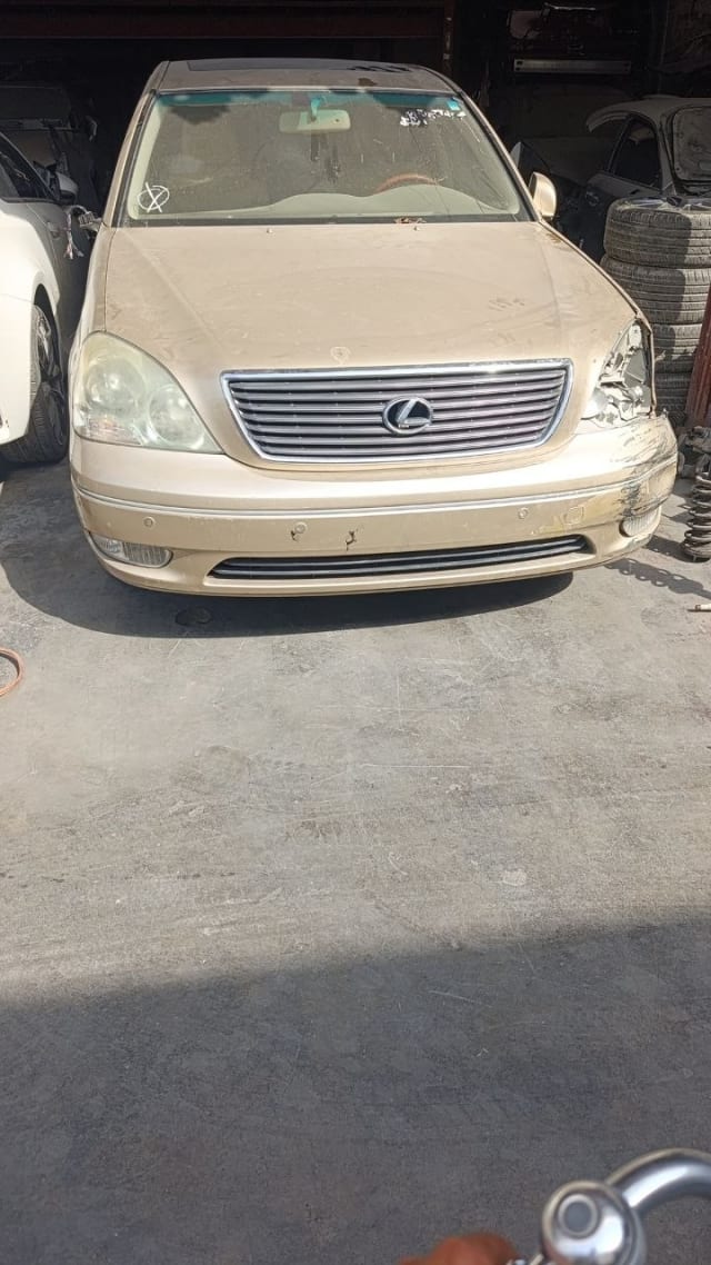Gold Lexus LS430 sedan front — grille, headlights, bumper and hood, Sharjah market