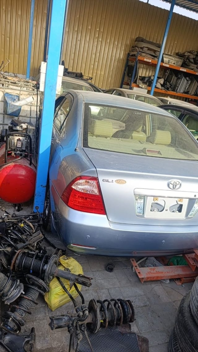Silver Toyota Corolla GLi sedan rear cut — bumper, tail lights and tailgate, Sharjah market