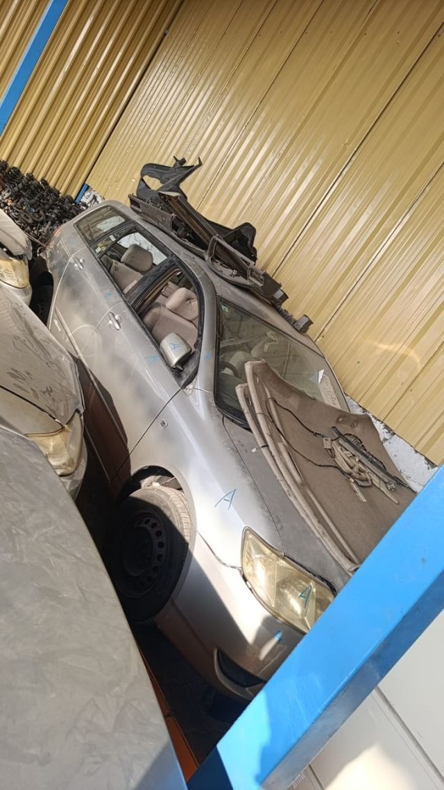 Beige Toyota Corolla halfcut — front end with headlights, hood, doors and interior, Sharjah market