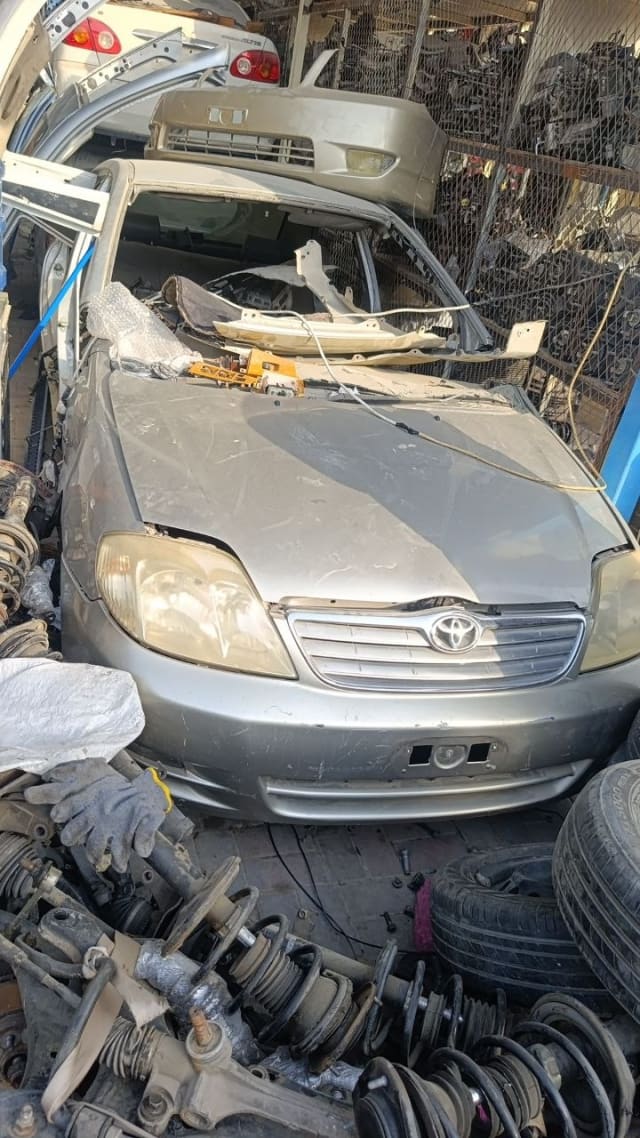 Silver Toyota Corolla sedan halfcut front — bumper, grille, headlights and hood, Sharjah market