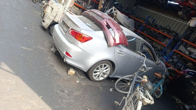 Silver Lexus IS250 sedan car for parts — rear with trunk, tail lights and alloy wheel, Sharjah market