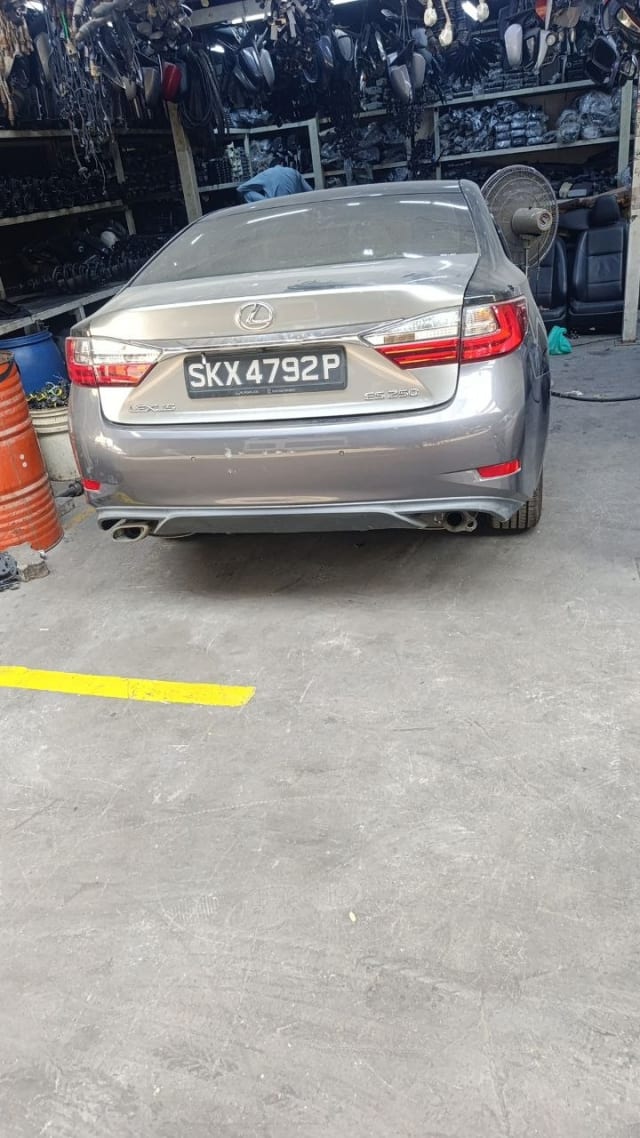 Grey Lexus ES250 sedan rear view — rear bumper, tail lights and trunk lid, Sharjah market