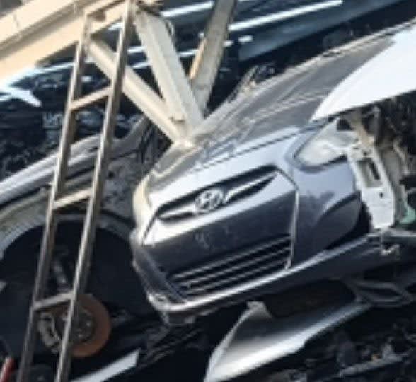 Grey Hyundai Accent sedan front halfcut — bumper, grille and headlights, Sharjah market