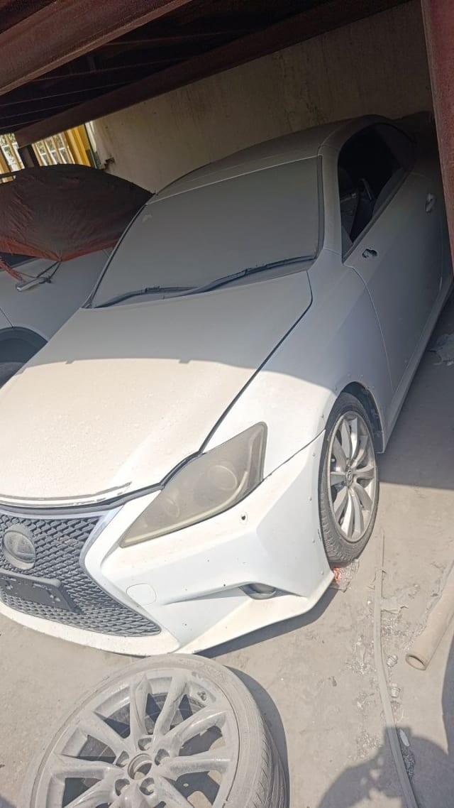 White Lexus IS sedan car for parts — front bumper, grille, headlights and hood, Sharjah market