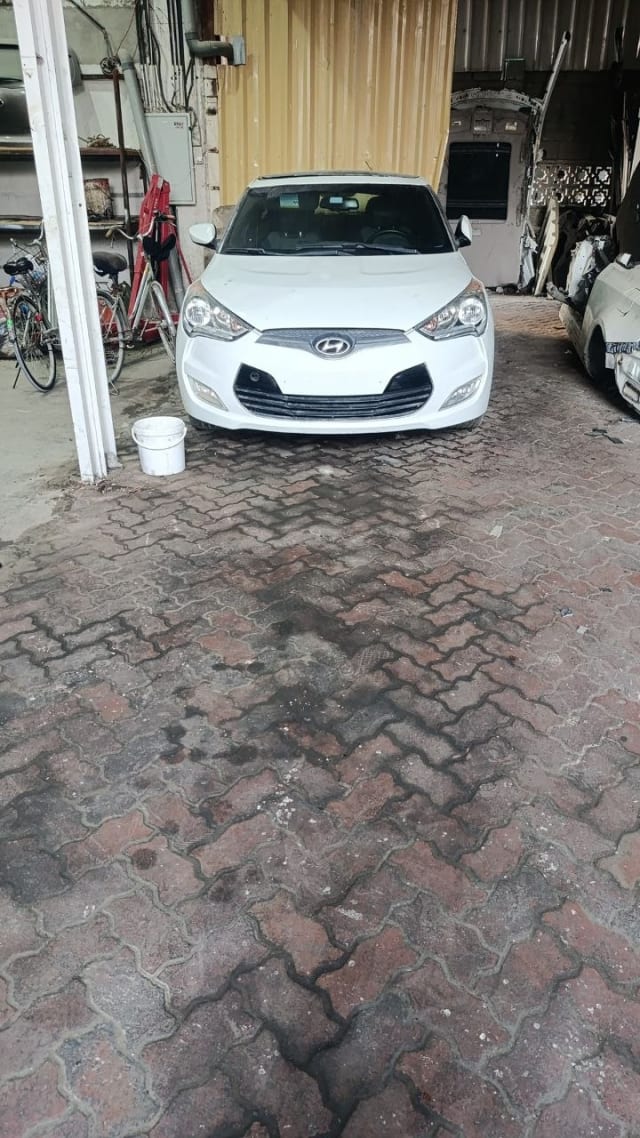 White Hyundai Veloster front — bumper, grille, headlights and hood, Sharjah market