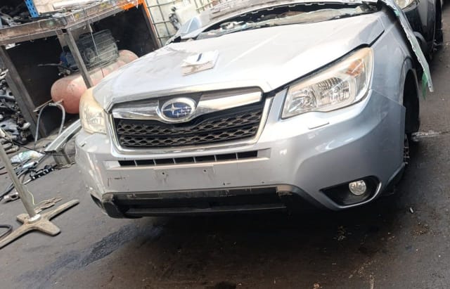 Silver Subaru Forester SUV front halfcut — bumper, grille, headlights and hood, Sharjah market