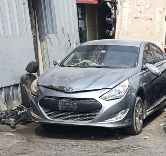 Grey Hyundai Sonata Hybrid sedan front — bumper, grille, headlights and hood, Sharjah market