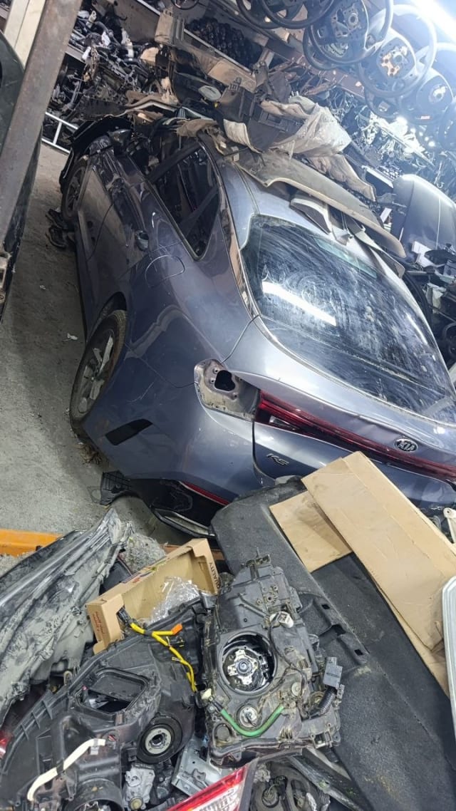 Dark grey Kia K5 sedan rear halfcut — tailgate, taillights and rear glass, Sharjah market