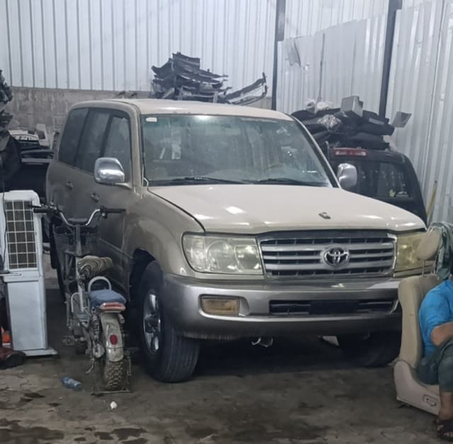 Gold Toyota Land Cruiser SUV for parts — front bumper, grille, headlights and hood, Sharjah market
