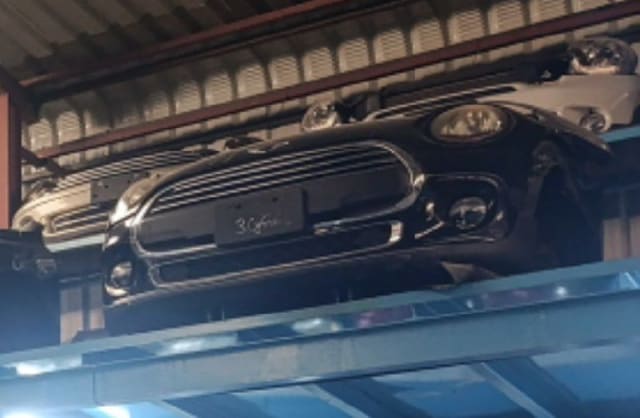 Dark MINI Cooper hatchback front halfcut — bumper, grille, headlights and fog lights, Sharjah market