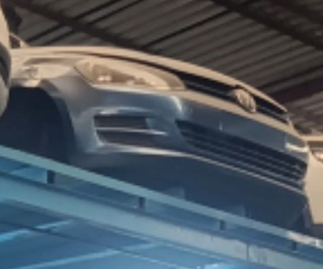 Silver Volkswagen Golf front halfcut — bumper, grille and headlight, Sharjah market