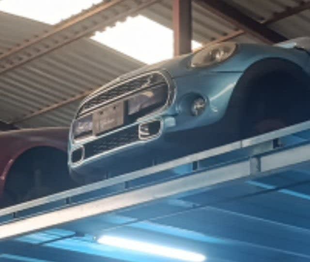 Light blue MINI Cooper hatchback front halfcut — grille, bumper and headlights, Sharjah market