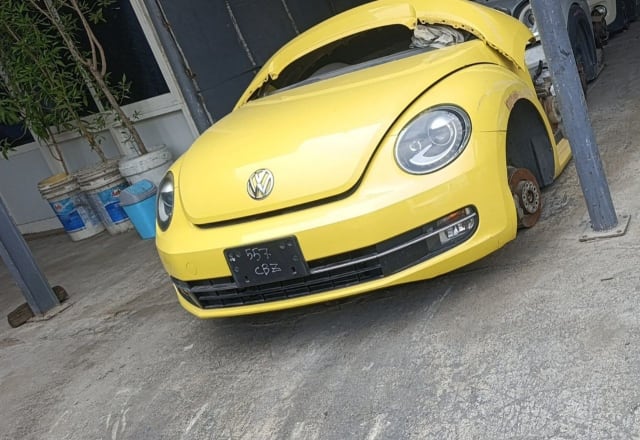 Yellow Volkswagen Beetle front halfcut — bumper, grille, headlights and hood, Sharjah market