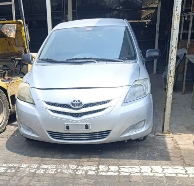 Silver Toyota Yaris sedan front — bumper, grille, headlights and hood, Sharjah market