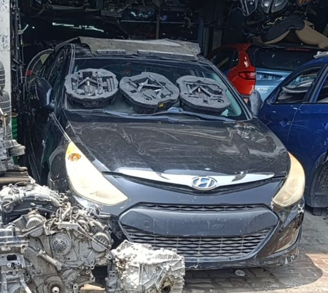 Black Hyundai Sonata sedan front halfcut — bumper, grille, headlights and hood, Sharjah market