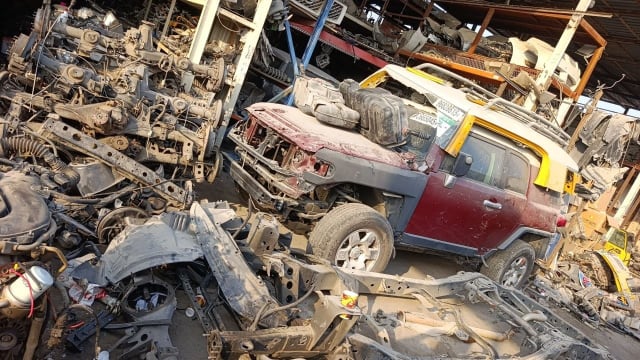 Maroon Toyota FJ Cruiser SUV halfcut — doors, fender, alloy wheel and radiator support, Sharjah market