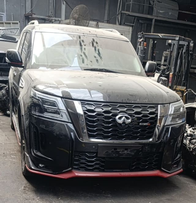Black Nissan Patrol Nismo SUV front — grille, LED headlights, red-lip bumper and hood, Sharjah market