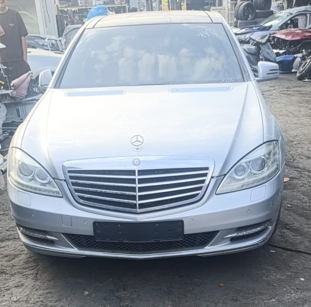 Silver Mercedes-Benz S-Class sedan front end — bumper, grille and headlights, Sharjah market