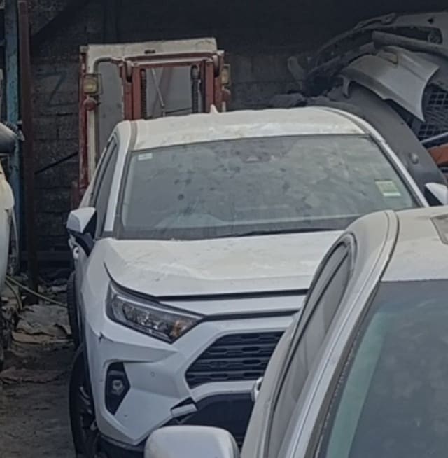 White Toyota RAV4 SUV front — bumper, grille, headlights and hood, Sharjah market