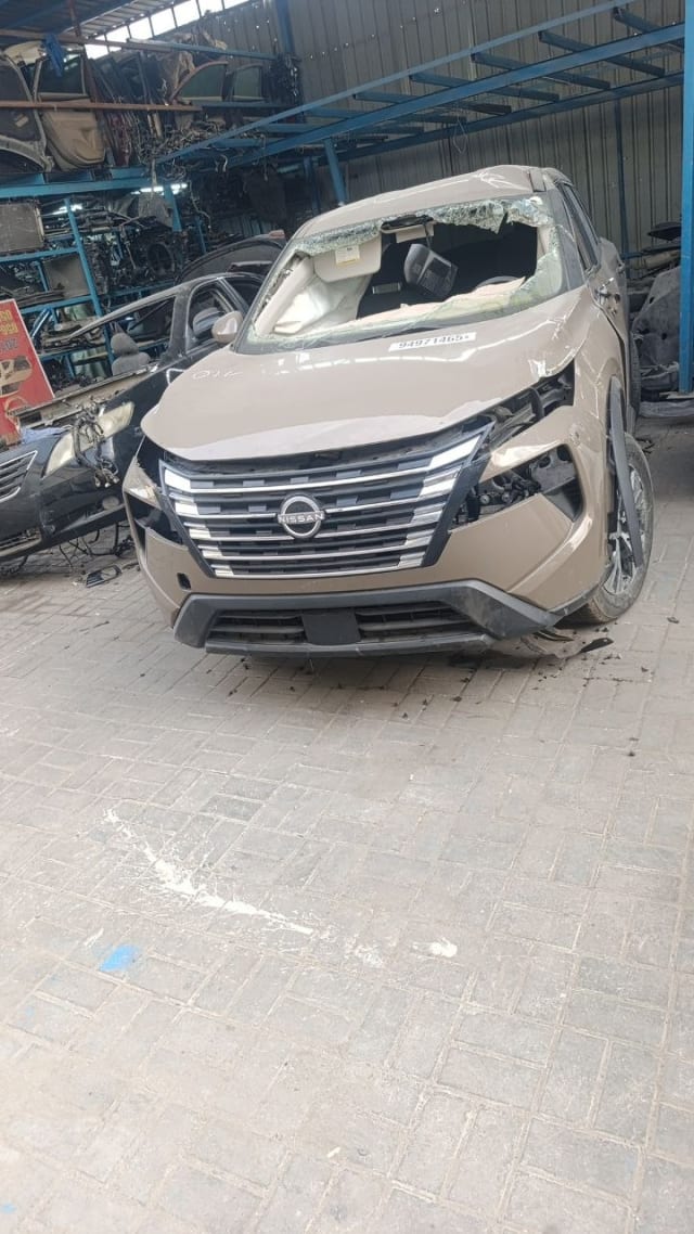 Beige Nissan X-Trail SUV halfcut front — grille, bumper and headlights, Sharjah market