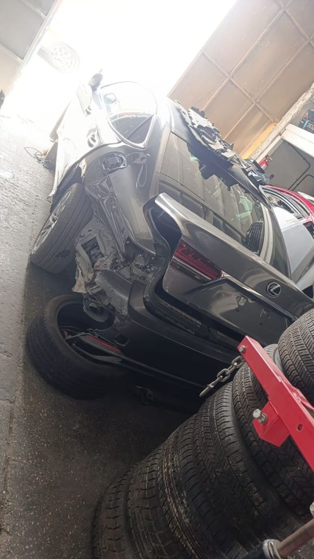 Dark grey Lexus LX570 SUV halfcut — rear bumper, tailgate, taillights and wheels, Sharjah market