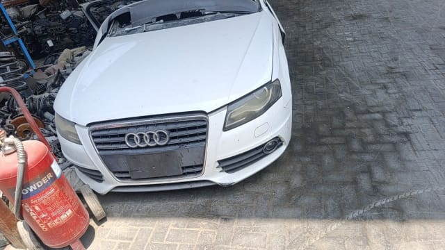 White Audi A4 sedan halfcut front end — hood, bumper, grille and headlights, Sharjah market