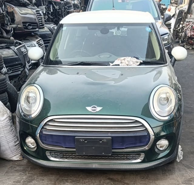 Dark green MINI Cooper F55/F56 front halfcut — bumper, grille and round headlights, Sharjah market