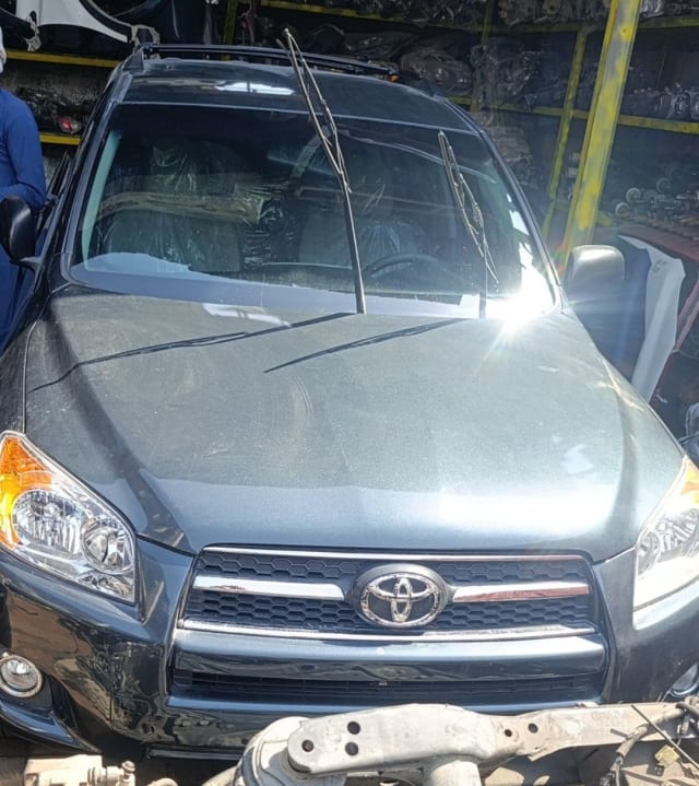 Dark grey Toyota RAV4 SUV front halfcut — bumper, grille, headlights and hood, Sharjah market
