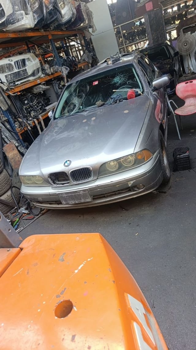 Silver BMW 5-Series sedan front — bumper, kidney grille, round headlights and hood, Sharjah market