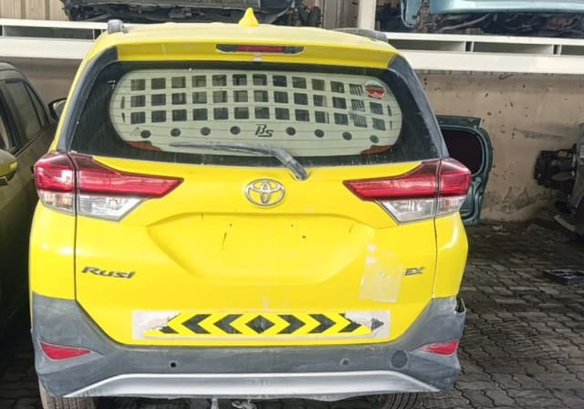Yellow Toyota Rush SUV rear cut — tailgate, tail lights and rear bumper, Sharjah market