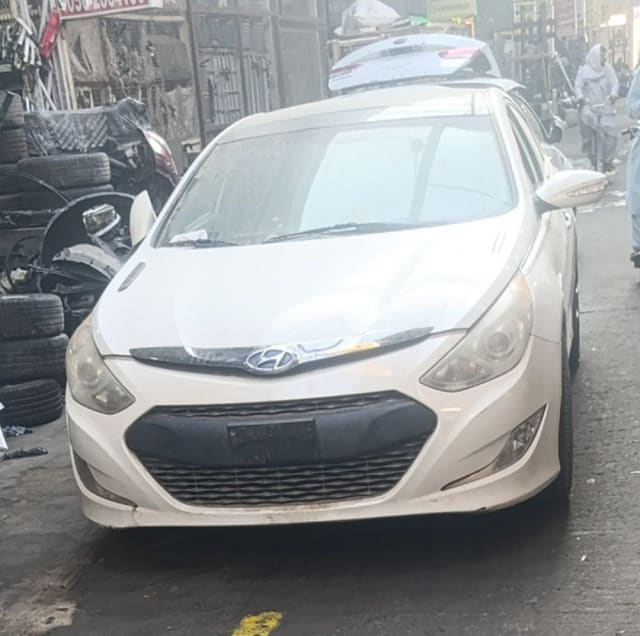 White Hyundai Sonata sedan front — bumper, grille, headlights and hood, Sharjah market