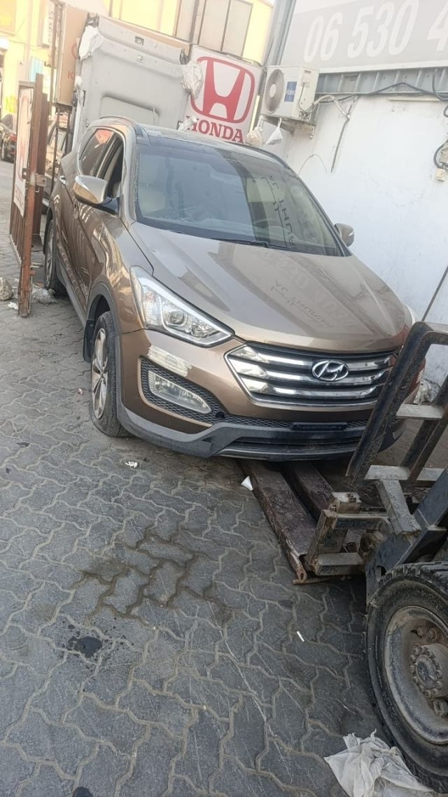 Brown Hyundai Santa Fe SUV front — bumper, grille and headlights, Sharjah market