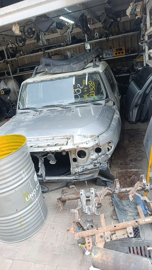 Silver Toyota FJ Cruiser SUV halfcut — cabin, hood and doors with front bumper removed, Sharjah market