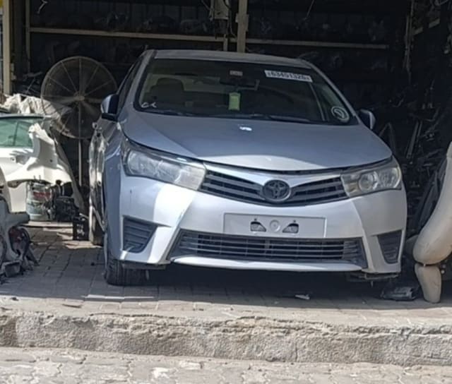 Silver Toyota Corolla sedan front end — bumper, grille, headlights and hood, Sharjah market