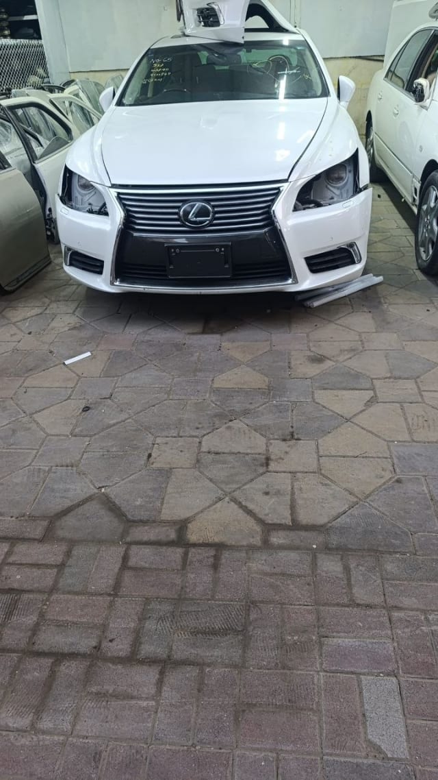 White Lexus LS460 sedan front halfcut — bumper, grille and headlights, Sharjah market