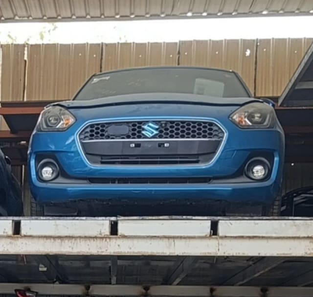 Blue Suzuki Swift hatchback front cut — bumper, grille, headlights and fog lights, Sharjah market