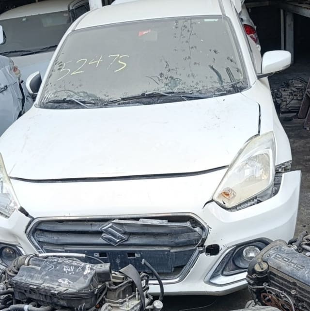 White Suzuki Dzire sedan halfcut front — hood, grille, headlight and bumper, Sharjah market