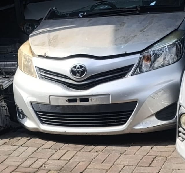 Silver Toyota Yaris/Vitz front cut — bumper, grille, emblem and headlights, Sharjah market
