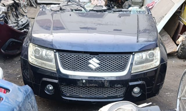 Dark blue Suzuki Grand Vitara SUV front halfcut — bumper, grille, headlights and hood, Sharjah market
