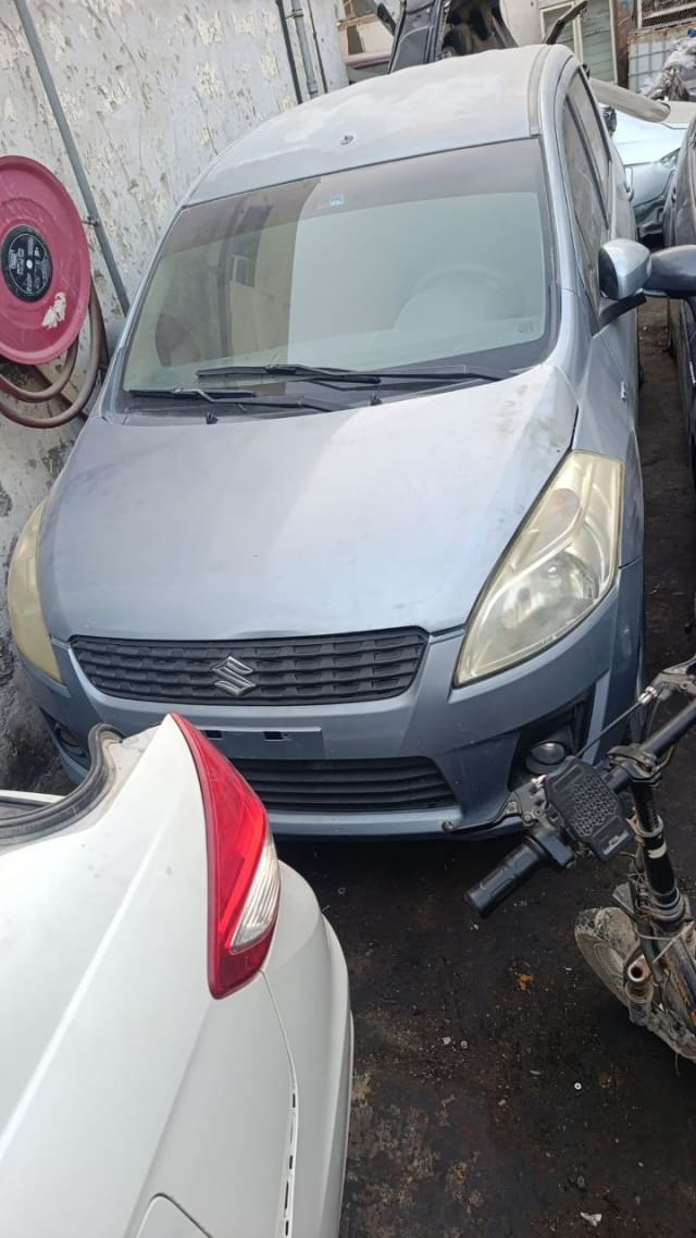 Light blue Suzuki Ertiga MPV front cut — bumper, grille, headlights and hood, Sharjah market