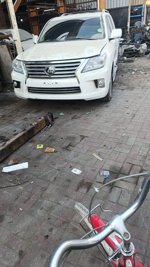 White Lexus LX570 SUV front end for parts — bumper, grille and headlights, Sharjah market