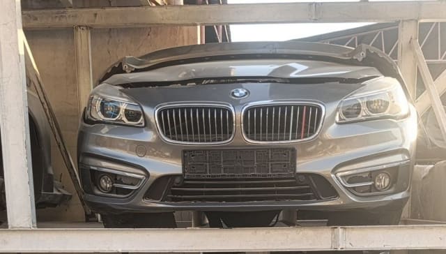 Grey BMW 2-Series Active Tourer front halfcut — bumper, kidney grille and headlights, Sharjah market