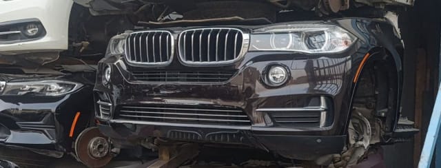 Dark brown BMW X5 front halfcut with bumper, kidney grille, headlights and fog lights, Sharjah market