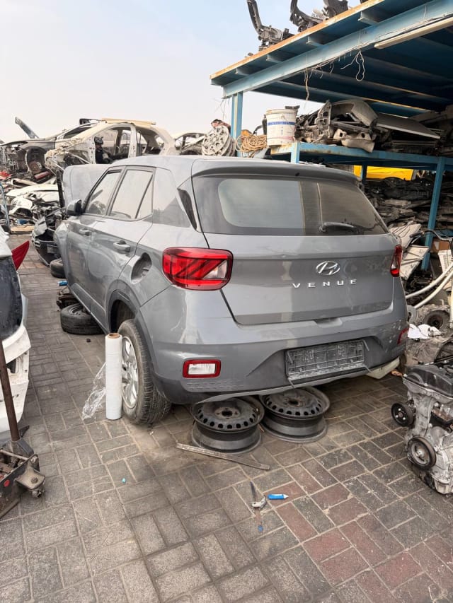 Grey Hyundai Venue SUV for parts, rear view with tailgate, tail lights and rear bumper, Sharjah market