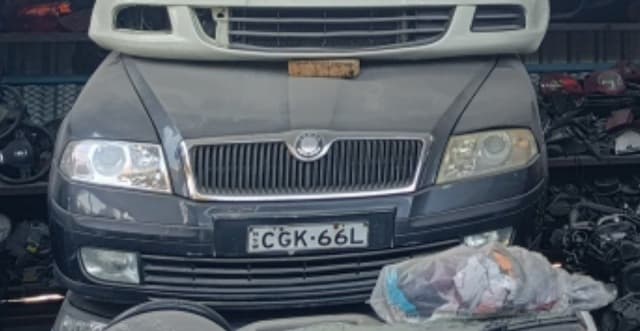 Dark grey Skoda Octavia front halfcut with hood, chrome grille, headlights and bumper, Sharjah market