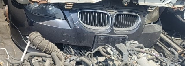 Dark grey BMW 5-Series halfcut: front bumper, kidney grille, headlights and engine, Sharjah market